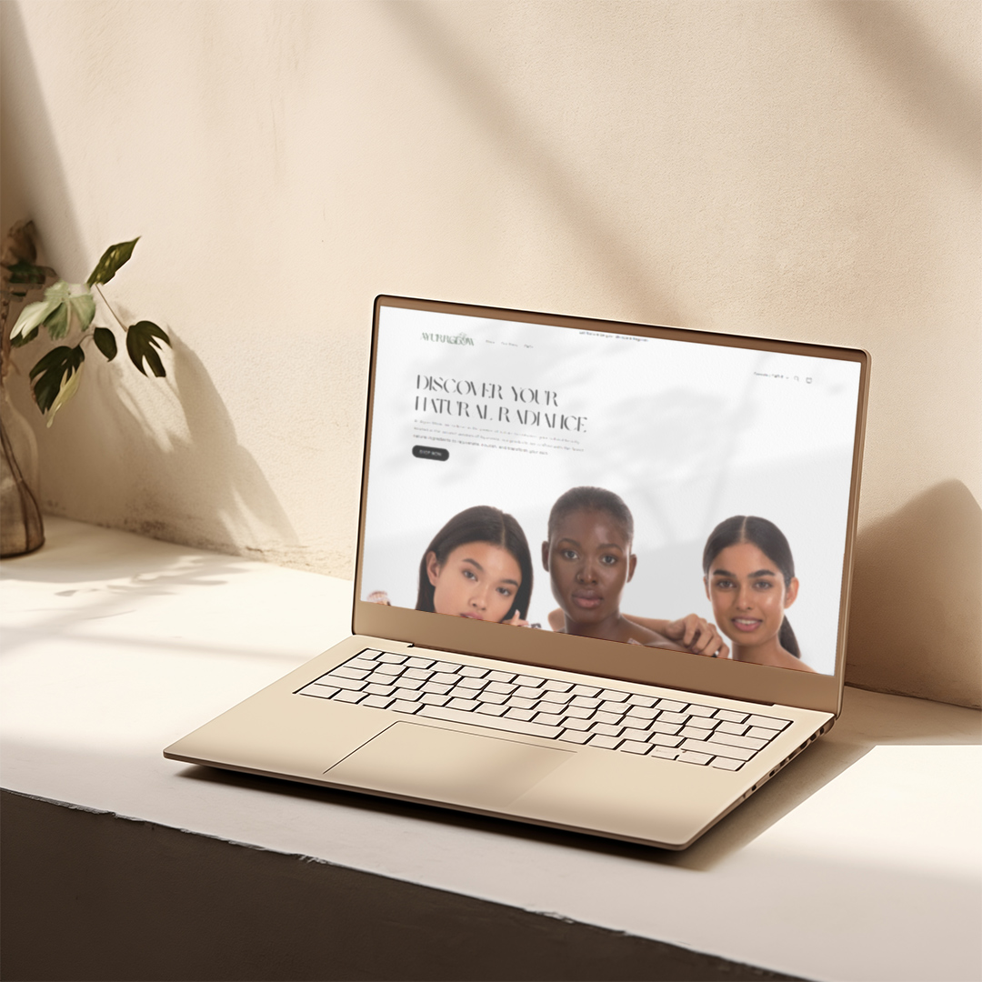 Angled view of the AyurGlow website on a laptop