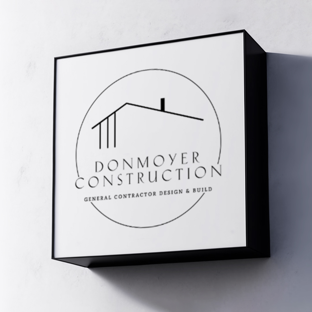 Donmoyer Construction identity presented on a framed wall sign
