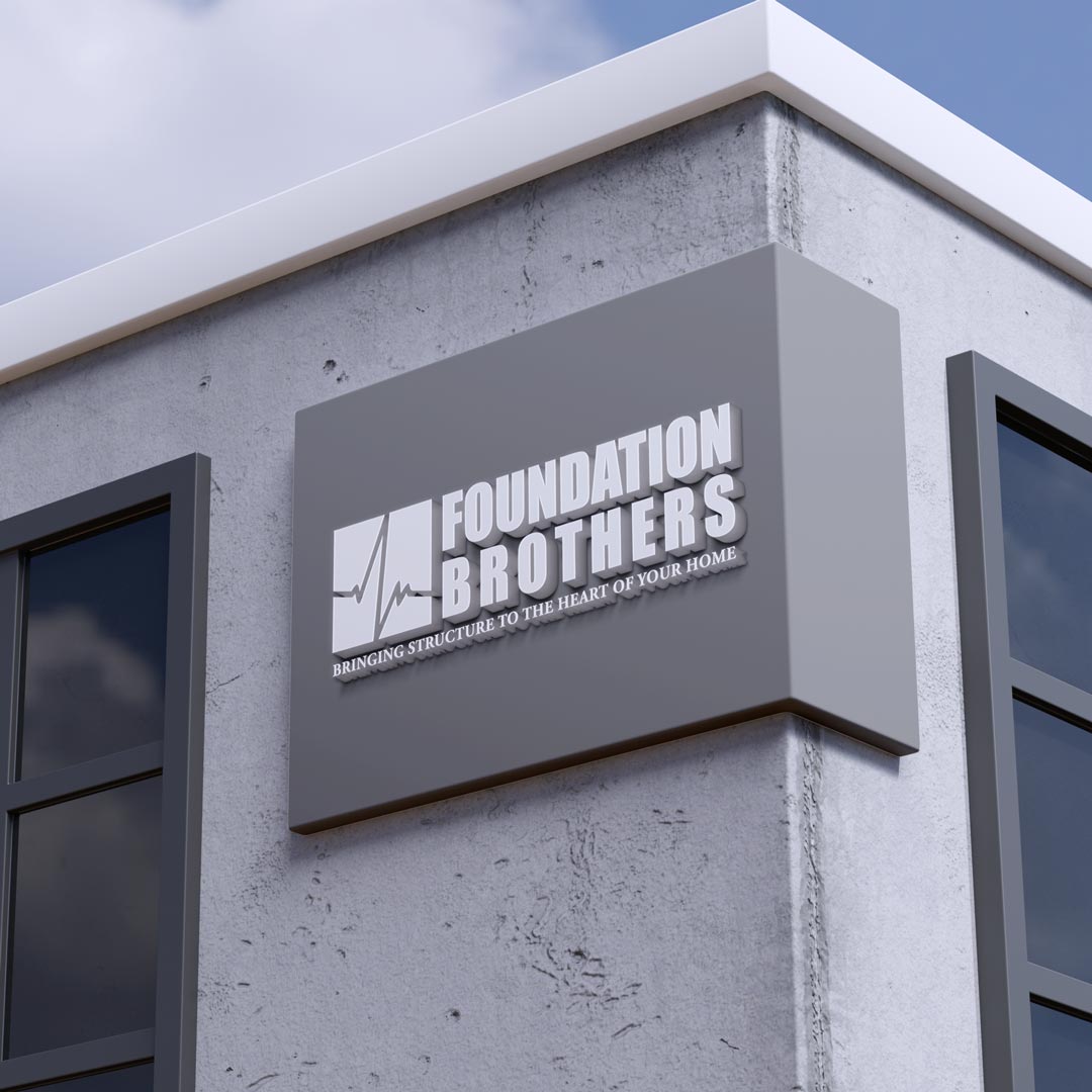 Foundation Brothers logo on a grey corner building sign