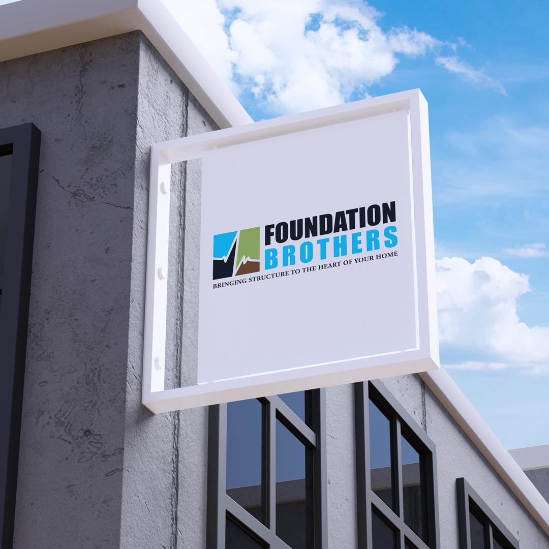 Foundation Brothers logo on a white projecting building sign